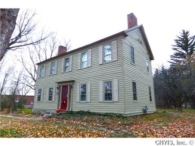 Exterior Front. The home features original wood si