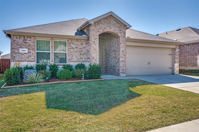 Beautifully landscaped front flower beds are a warm welcome.