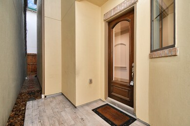 A charming private entrance that adds the apeal to the space.