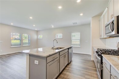 Kitchen featuring appliances with stainless steel