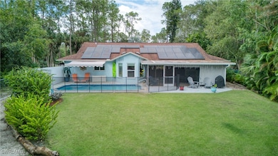 Rear view of property featuring a patio, a fenced