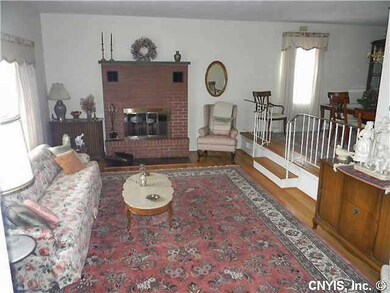 Living Room. Beautiful hardwood floors and woodbur