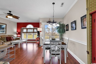 Dining space featuring a textured ceiling, ornamen