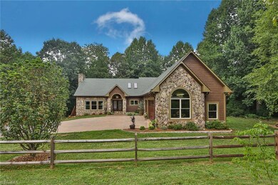 Stately home privately nestled on 26 acres of lush pasture and woods