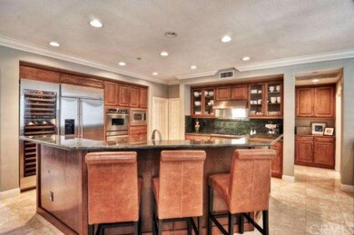 Open kitchen features GE Monogram appliances and S