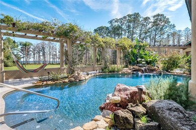 Feather rock and Tropical plants surround the pool