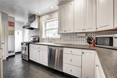 Kitchen with Pantry and Tiled Backsplash