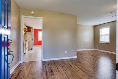 OPEN THE FRONT DOOR AND ENTER INTO THE ENTERTAINING LIVING ROOM