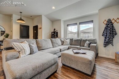 Living room with hardwood / wood-style flooring