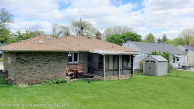 Back of house with shed