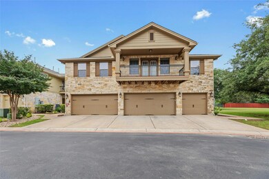 View of front of house featuring a balcony, an at