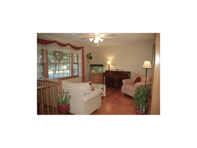 Living room the beautifully maintained hardwood fl