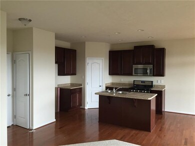 kitchen with maple cabinets and hardwood floors, s