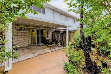 cozy, covered patio area with a tiled floor, parti