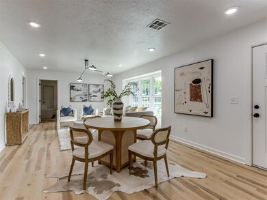 Dining space with light wood-style floors, baseboa