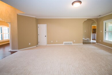 Spacious, warm and inviting great room is open to 