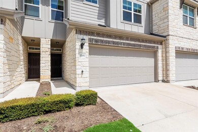 Doorway to property featuring an attached garage,