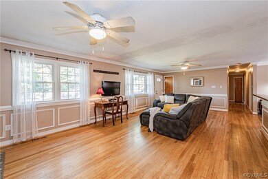 Living room with plenty of natural light, crown mo