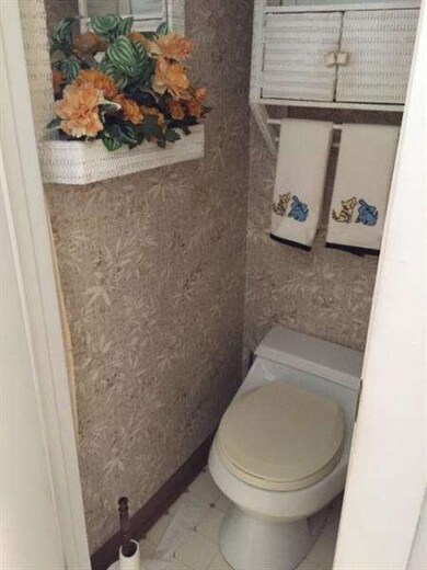 Powder room on ground floor. Just off kitchen.