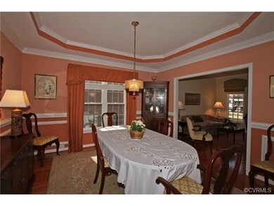 Lovely dining room with  hardwood floor, tray ceil