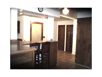 Kitchen. Kitchen has corian topped breakfast bar a