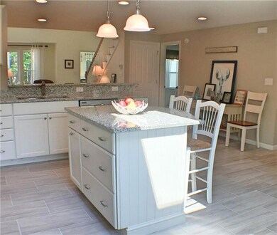 Kitchen with island and open floor...