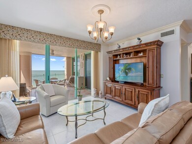 Living area with a chandelier and light tile patte
