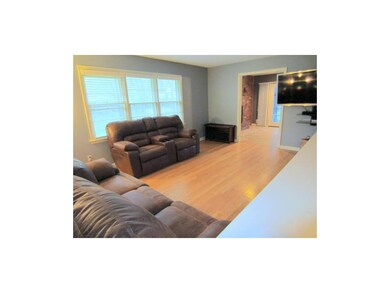 Living Room.  Refinished Hardwoods, White Faux Woo