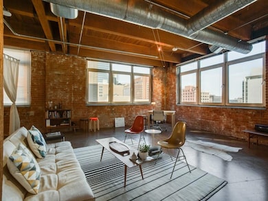 View of loft from entrance. 2 walls of windows...g
