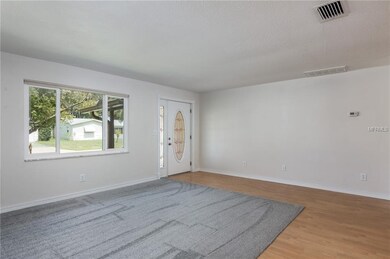 Living room with brand new carpet, newer impact ra