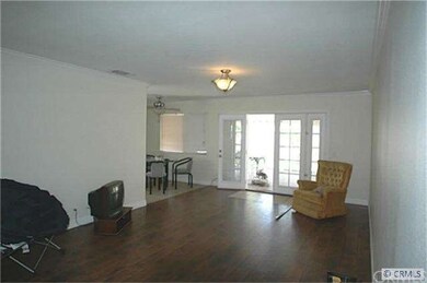Family room features French doors to covered patio