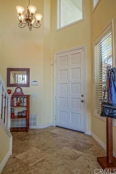 Formal entry with tile flooring.