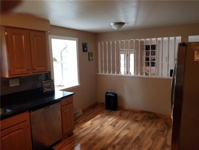 The kitchen steps down into the Family Room/Den wh