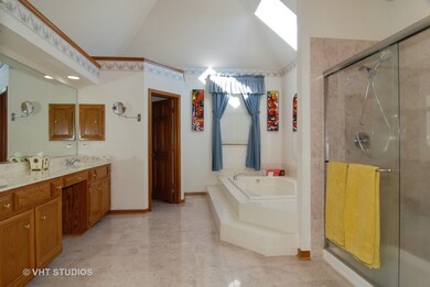 Enter bathroom to his/her (2) Walk in Closets on e