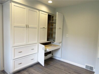 Built in spice racks and pull out drawers.