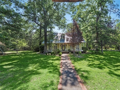 Paved walkway leading from drive to the home