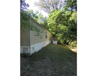 Exterior Back/Side. Deck Toward Back of Mobile