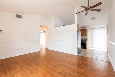 View into kitchen and the hall to the bedrooms and bath.