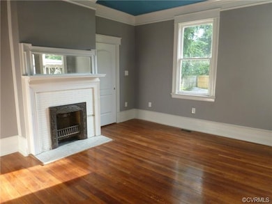 Charming Formal Dinning Room or better yet the Family Room with Original Fireplace! Recess Lighting and Gorgeous Triple Member Baseboard.