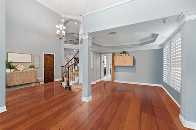 The formal dining with a tray ceiling and plantati