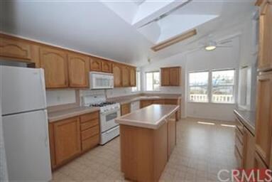 Spacious kitchen with an abundance of oak cabinetr