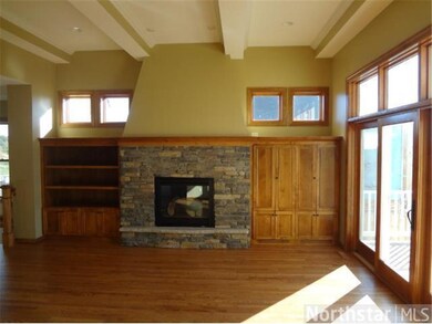 Main floor great room has gas fireplace and entert