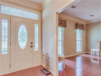 Leaded glass transom & side panels add style to th