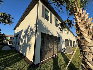 View of side of home with central air condition un