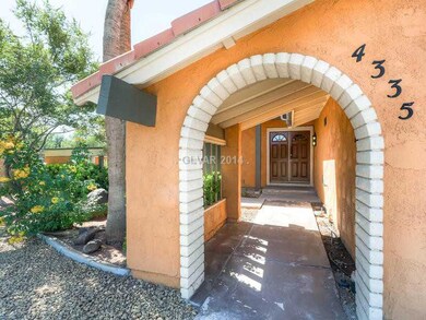 Facade/Exterior Front. Entering the home by large