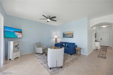 Tiled living room with ceiling fan