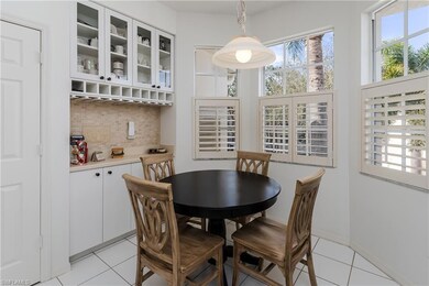Dining space featuring light tile patterned floors