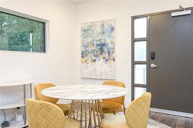 Dining area featuring baseboards and wood finished