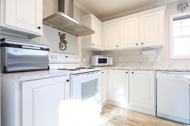 Kitchen with extractor fan, white appliances, whit