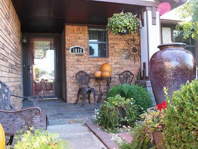 Exterior Front. Very Inviting Front Porch with Peaceful Waterfall